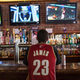 A fan watches news coverage of LeBron James’ impending return to Cleveland in downtown Cleveland on July 11, 2014.
Angelo Merendino/Getty Images